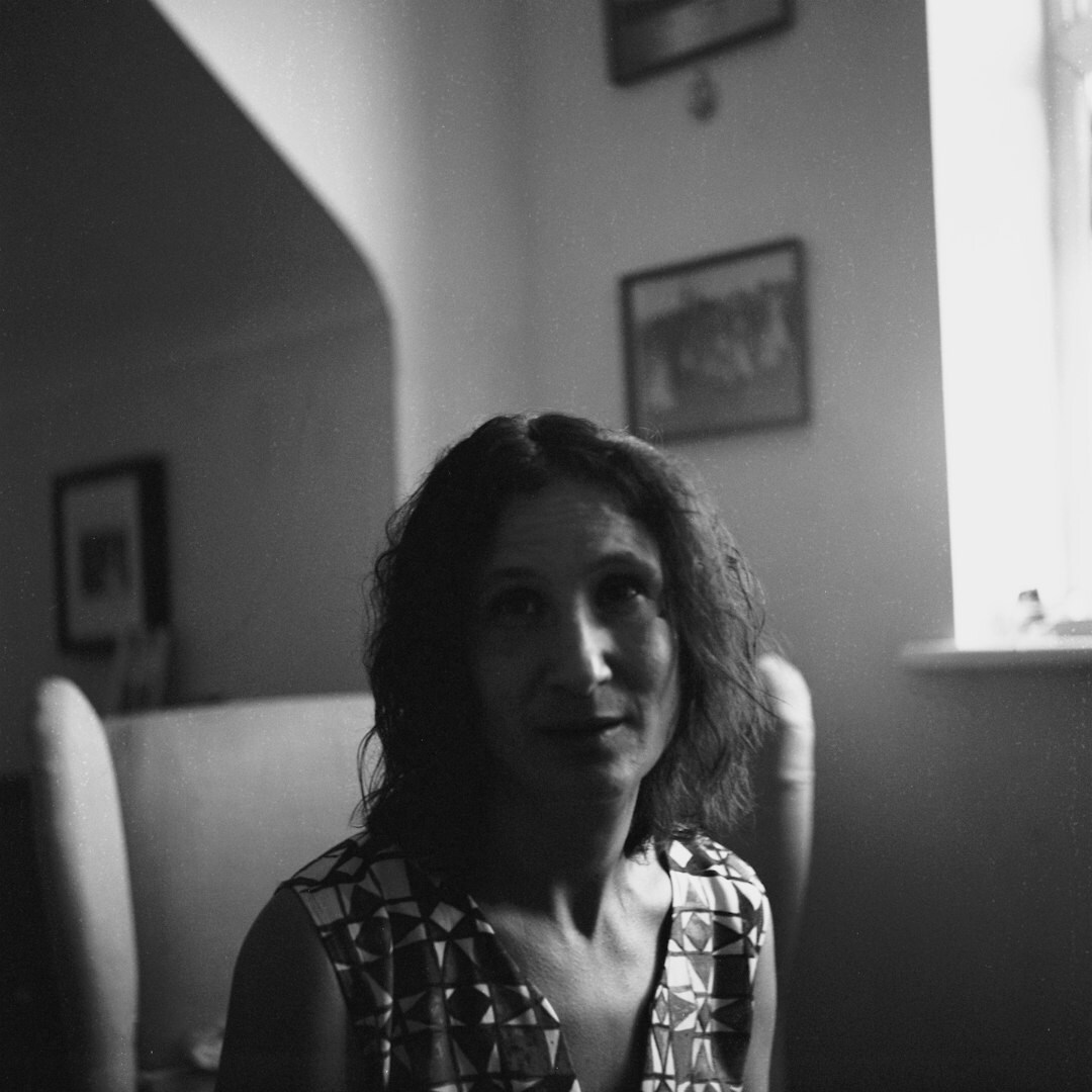 Studio portrait of an Argentine woman in her forties, an editor